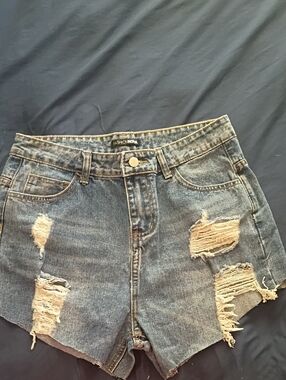 Fashion Nova Ripped High-Rise Denim Shorts in Medium Blue